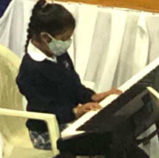 Zoya showcasing her piano playing skills during our assemblyjpg.jpg